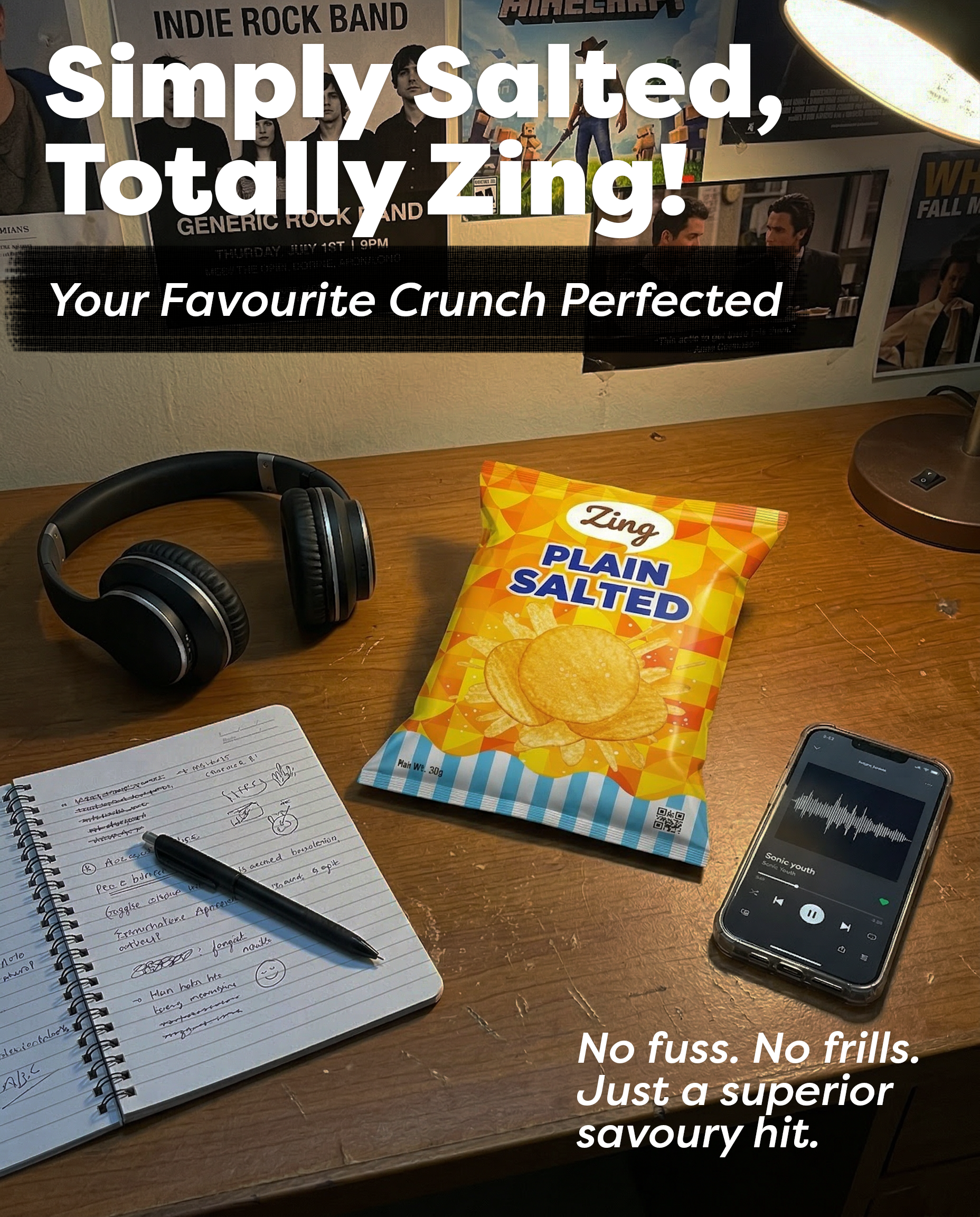 Desk with a bag of plain salted crisps and headphones on a wooden surface; bold white promo text 'Simply salted, Totally zing!' overlays the scene.